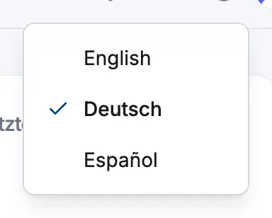 Die obere Leiste des Dashboards mit dem geöffneten Globus-Sprachmenü und den Einträgen English, Deutsch und Español