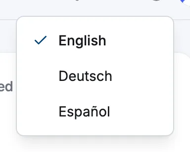 The dashboard top bar with the globe language menu open, showing English, Deutsch and Español